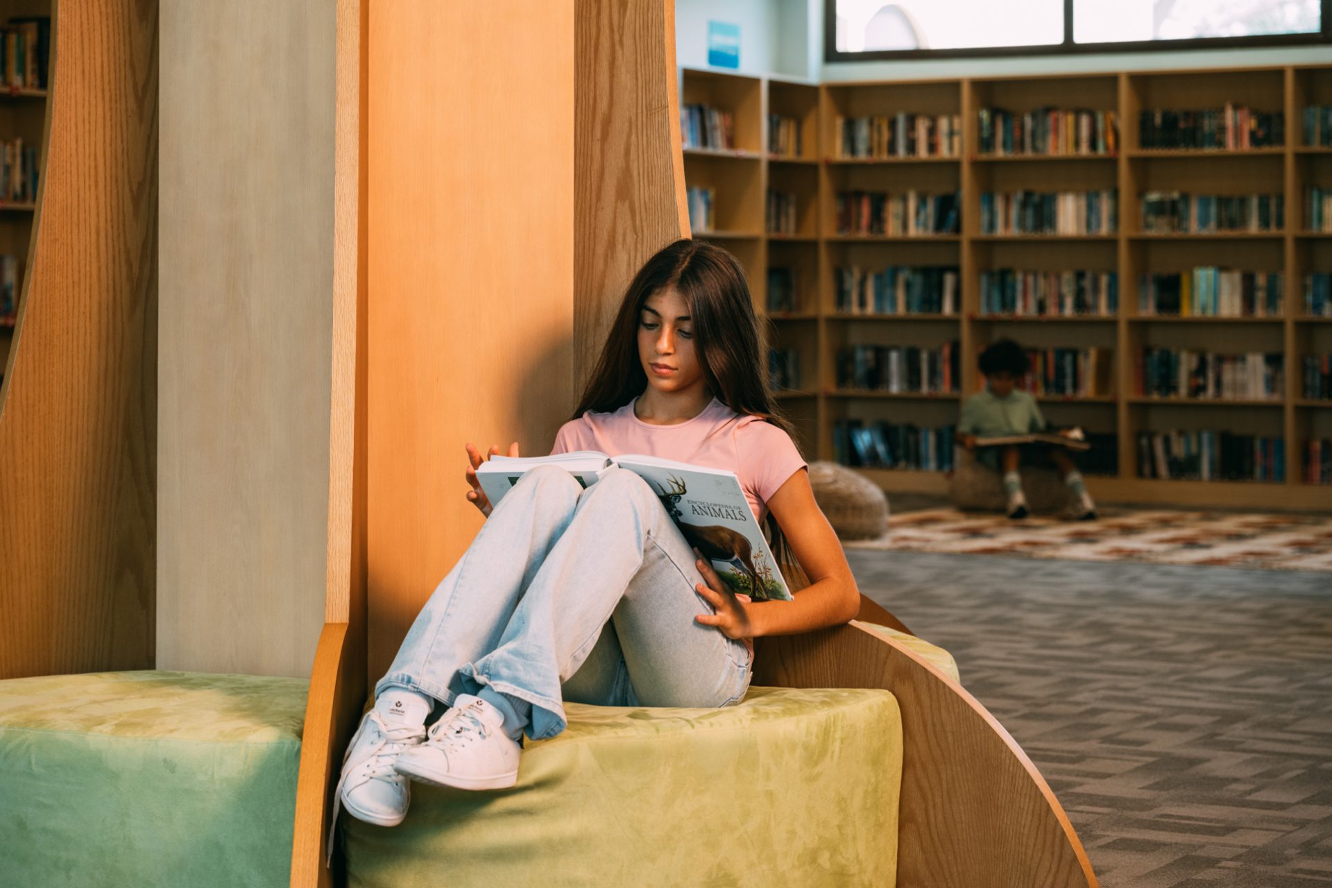 Girl reading at Awali Library
